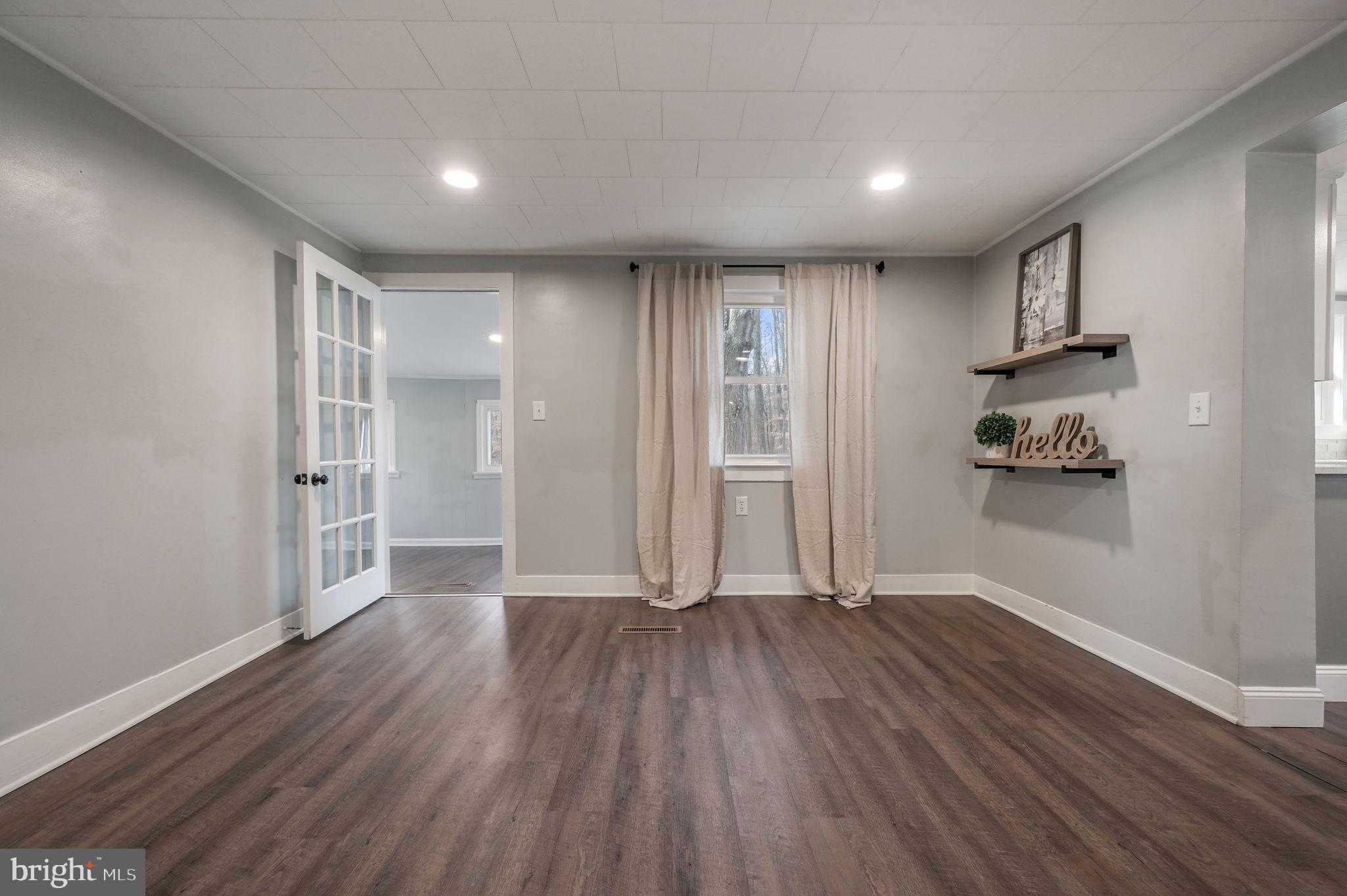 1312 Everetts Corner Road Hartly, DE 19953 - Photo 14 of 24 Living room opening up to laundry room/mud room