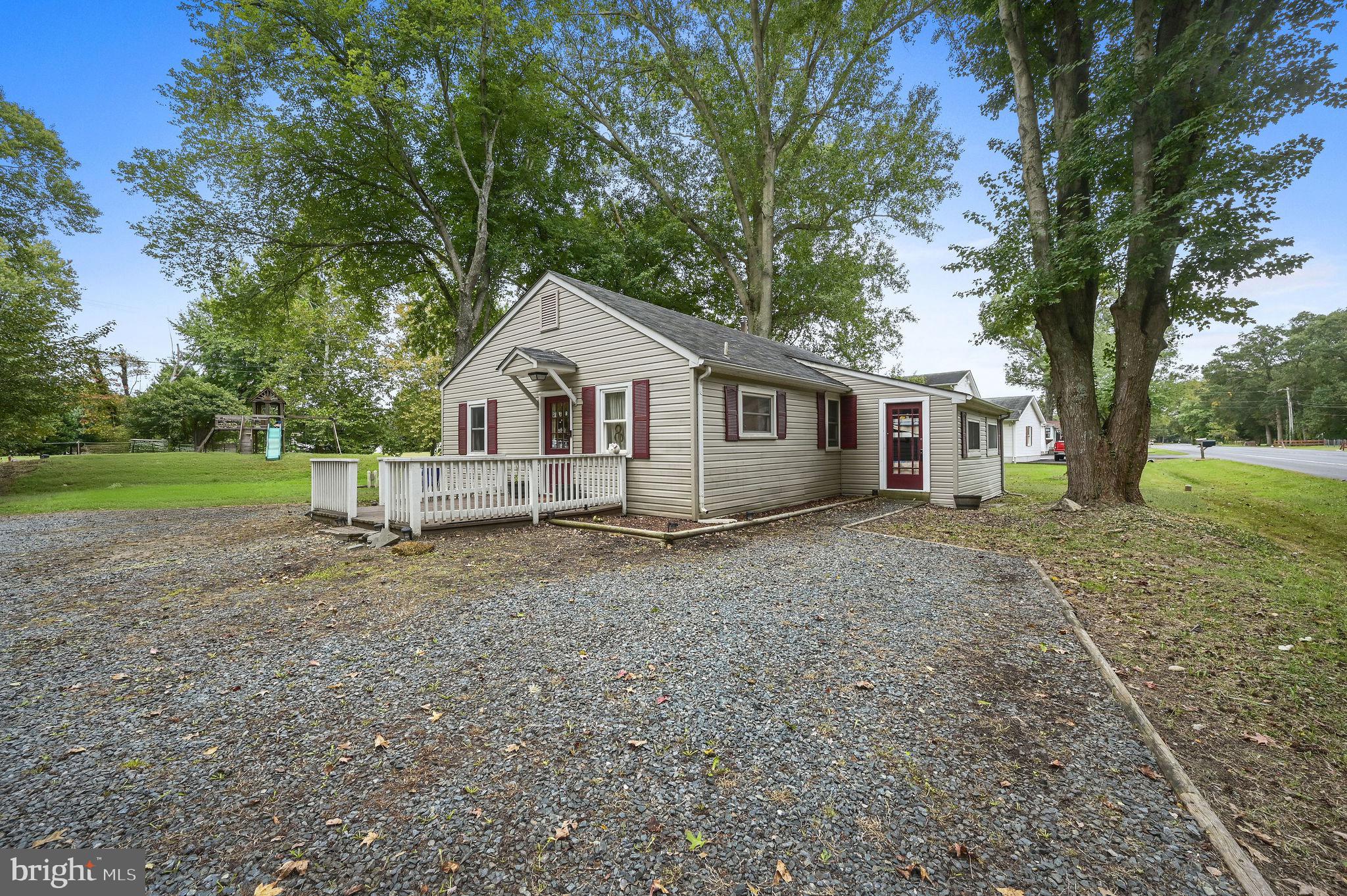 1312 Everetts Corner Road Hartly, DE 19953 - Photo 5 of 24 a house with trees in the background