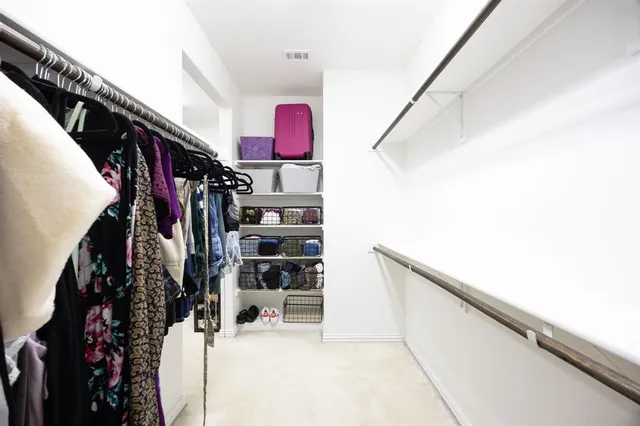 a workspace room with furniture and window