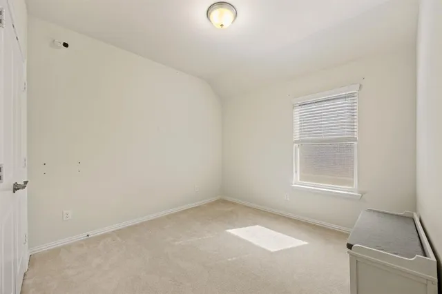 a view of storage and utility room with empty racks