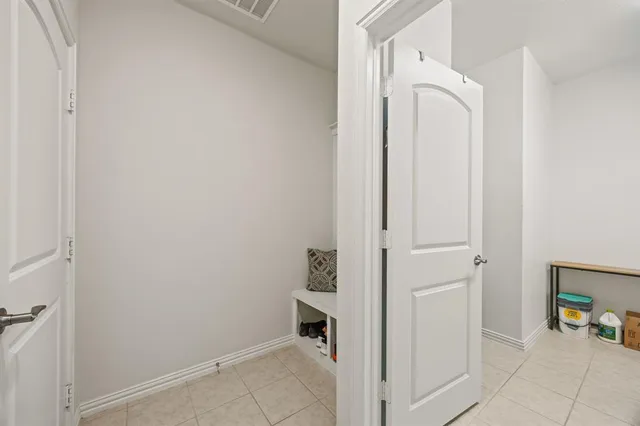a bathroom with a sink vanity and a tub