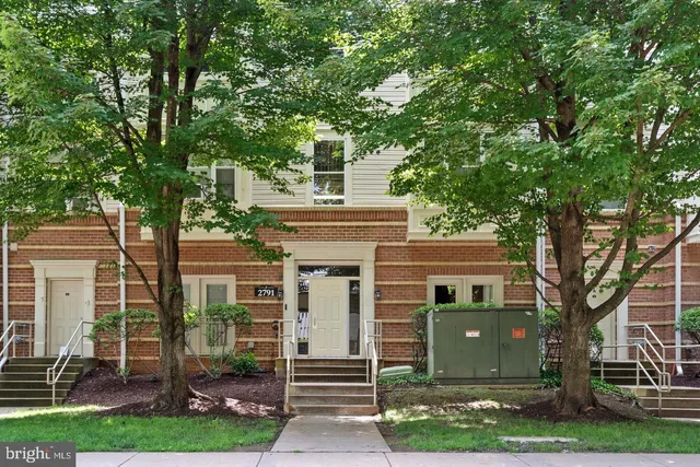 a view of a house with a snow on the road