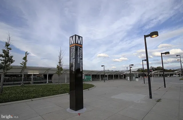 a view of white house with a snow on the road