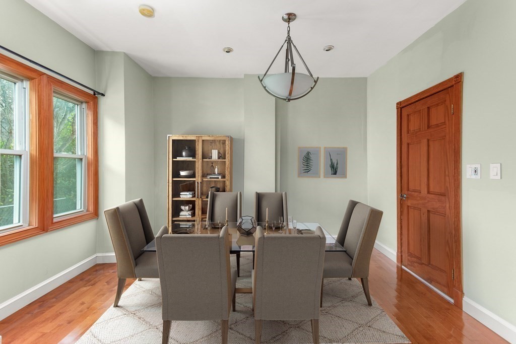 28 Stebbins Street Worcester, MA 01607 - Photo 12 of 29 a view of a dining room with furniture window and wooden floor