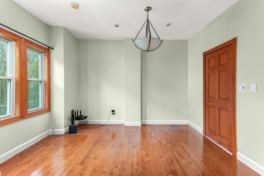 28 Stebbins Street Worcester, MA 01607 - Photo 13 of 29 a view of a room with wooden floor and windows