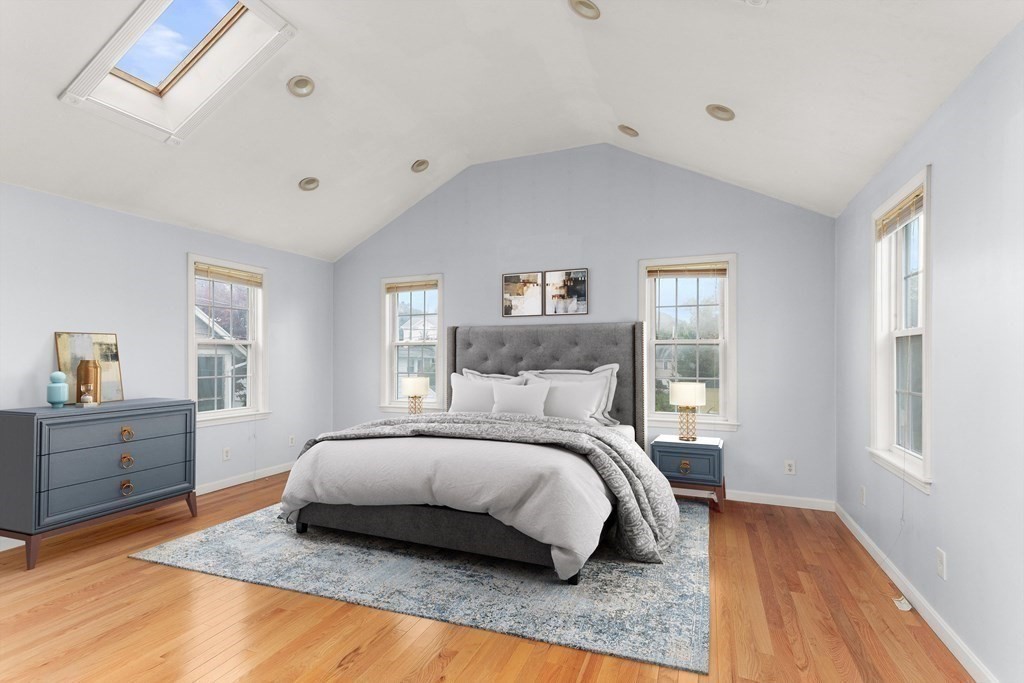 28 Stebbins Street Worcester, MA 01607 - Photo 14 of 29 a bedroom with a bed and wooden floor