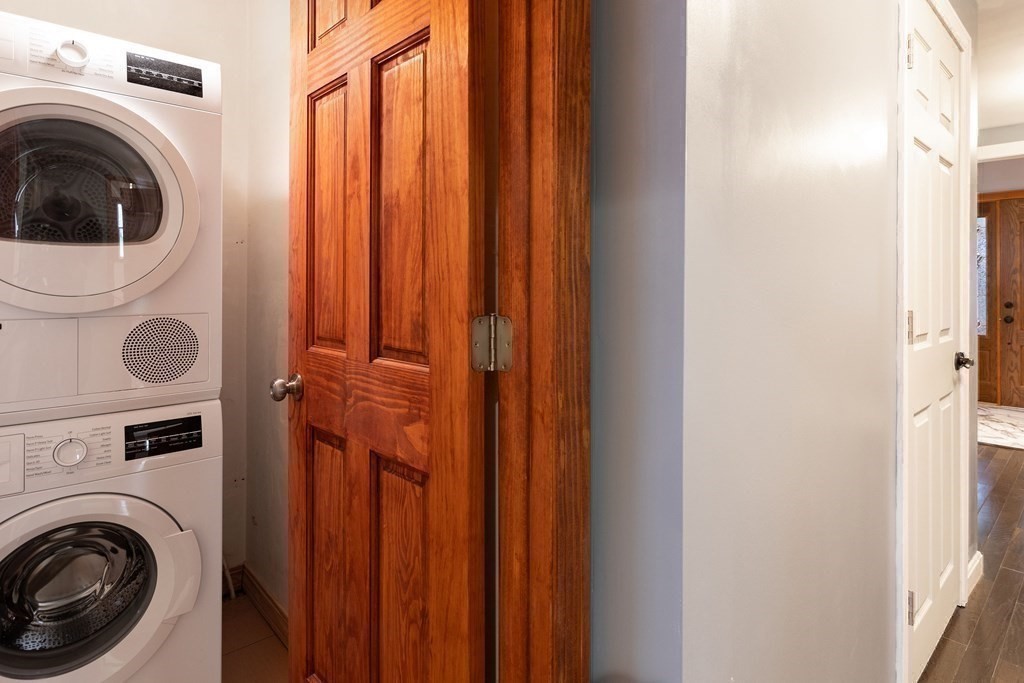 28 Stebbins Street Worcester, MA 01607 - Photo 21 of 29 a view of a hallway with washer and dryer