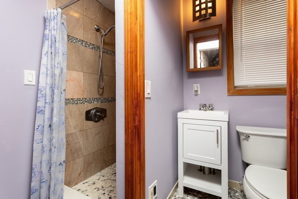 28 Stebbins Street Worcester, MA 01607 - Photo 25 of 29 a bathroom with a sink a toilet and shower