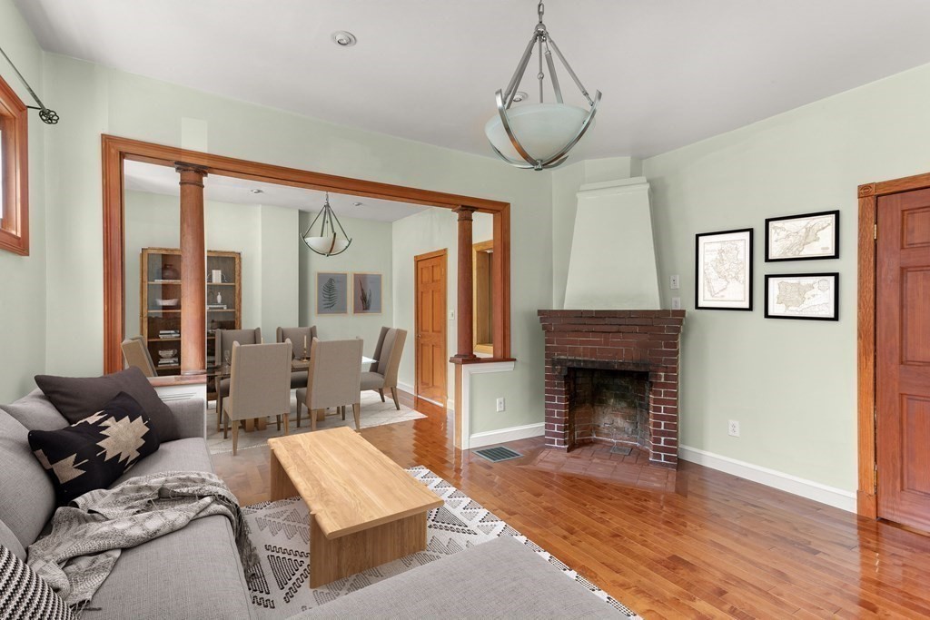 28 Stebbins Street Worcester, MA 01607 - Photo 9 of 29 a living room with furniture and a fireplace