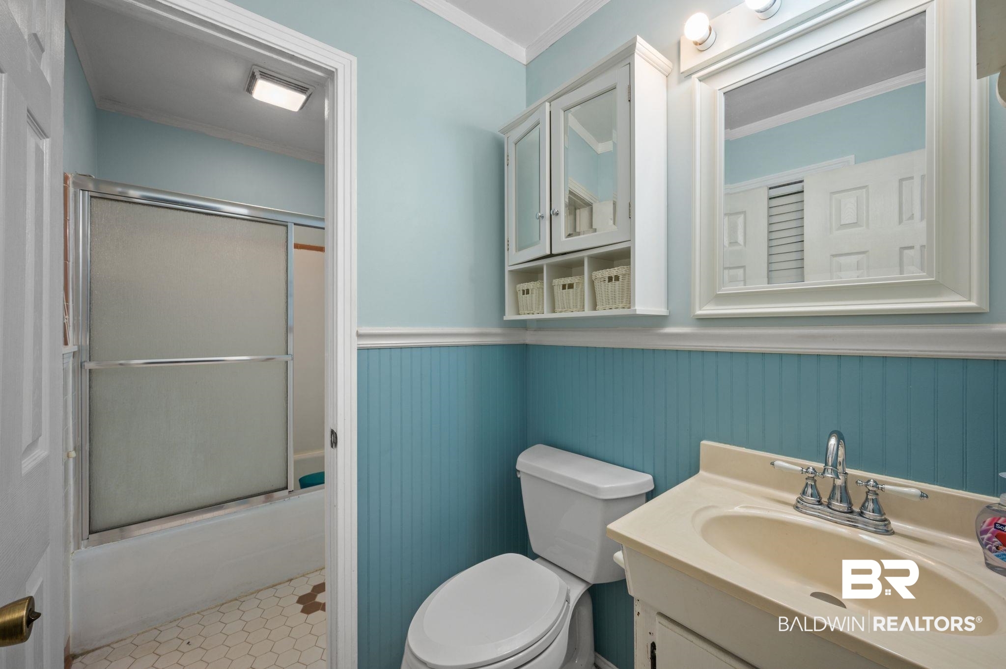 122 Rita Avenue Spanish Fort, AL 36527 - Photo 12 of 17 Full bathroom featuring toilet, a wainscoted wall, enclosed tub / shower combo, ornamental molding, and vanity
