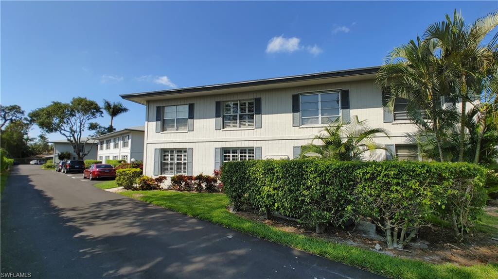 3300 Binnacle Drive, Unit 206 Naples, FL 34103 - Photo 1 of 11 a front view of a house with garden