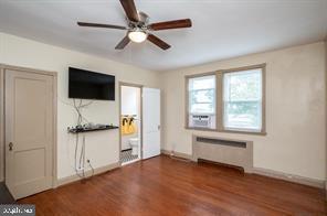 1618 Roundhill Road Baltimore, MD 21218 - Photo 23 of 50 a view of an empty room with a window and a kitchen