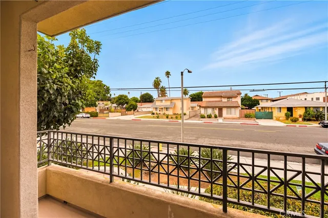 a view of a balcony with an outdoor seating