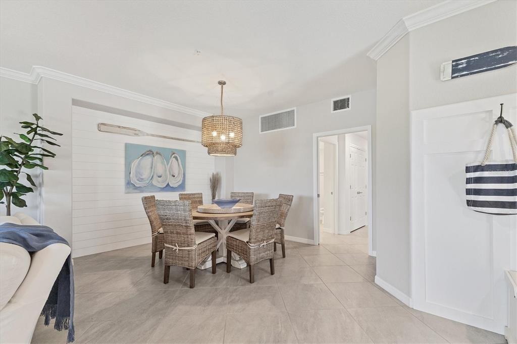 18113 Gawthrop Drive, Unit 101 Lakewood Ranch, FL 34211 - Photo 18 of 73 a view of a dining room with furniture
