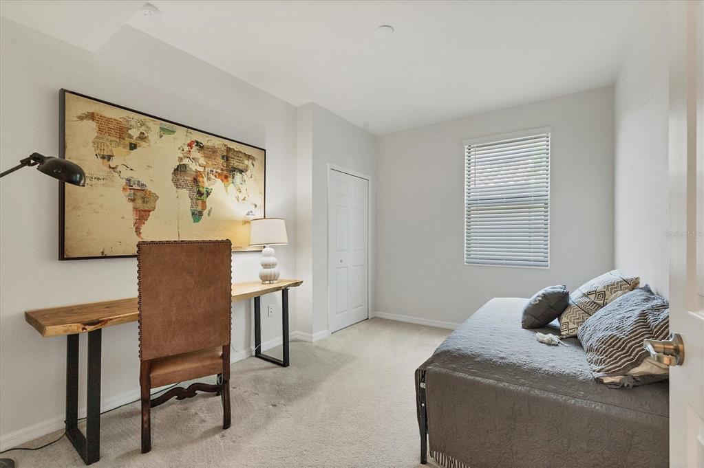 18113 Gawthrop Drive, Unit 101 Lakewood Ranch, FL 34211 - Photo 26 of 73 a bedroom with a bed and a window