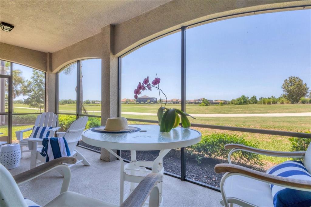 18113 Gawthrop Drive, Unit 101 Lakewood Ranch, FL 34211 - Photo 28 of 73 a view of a workspace with a table and chairs in patio
