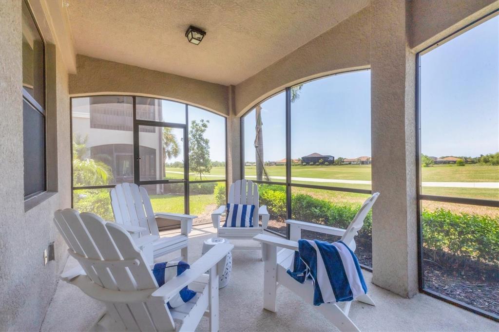 18113 Gawthrop Drive, Unit 101 Lakewood Ranch, FL 34211 - Photo 29 of 73 a view of living room with furniture and floor to ceiling window