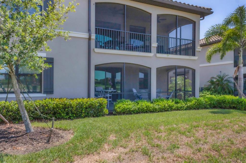 18113 Gawthrop Drive, Unit 101 Lakewood Ranch, FL 34211 - Photo 32 of 73 a front view of a house with a yard