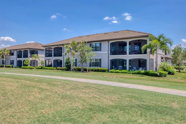 a living room with furniture wooden floor and a fireplace