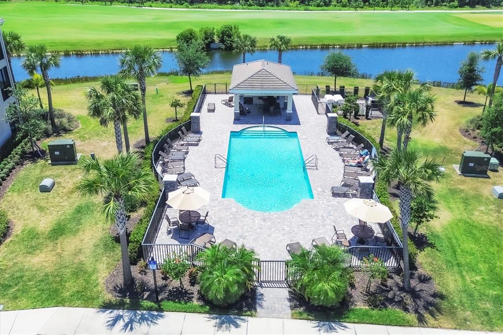 18113 Gawthrop Drive, Unit 101 Lakewood Ranch, FL 34211 - Photo 36 of 73 an aerial view of a house with a garden and lake view