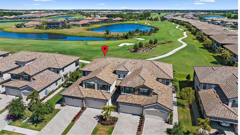 18113 Gawthrop Drive, Unit 101 Lakewood Ranch, FL 34211 - Photo 4 of 73 an aerial view of a house with outdoor space lake view