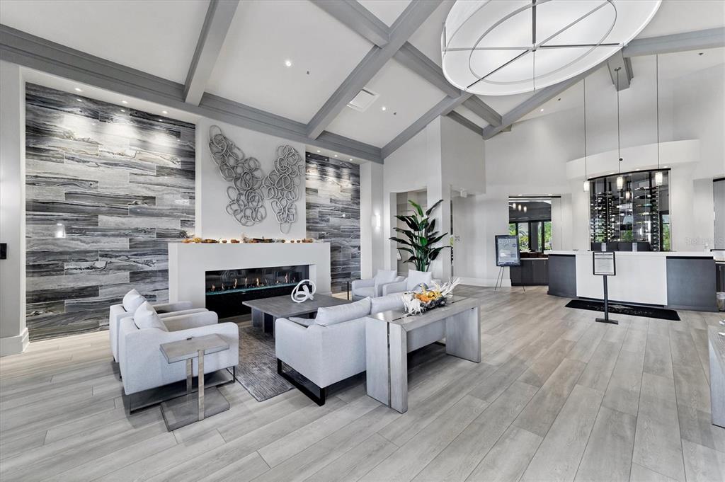 18113 Gawthrop Drive, Unit 101 Lakewood Ranch, FL 34211 - Photo 45 of 73 a living room with furniture wooden floor and a fireplace