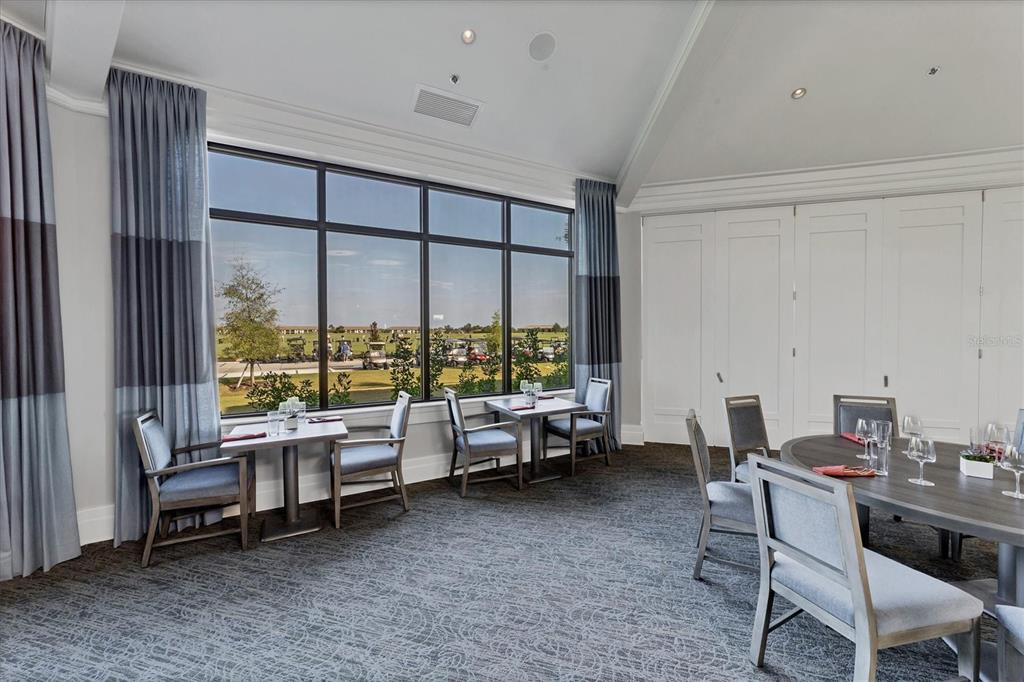 18113 Gawthrop Drive, Unit 101 Lakewood Ranch, FL 34211 - Photo 47 of 73 a living room with furniture and a large window