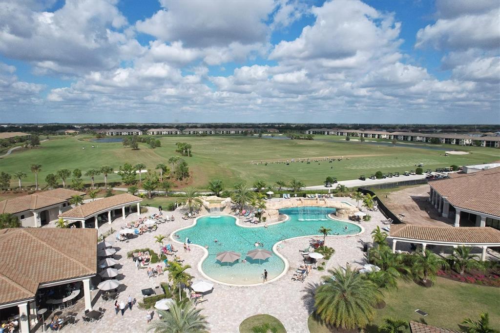 18113 Gawthrop Drive, Unit 101 Lakewood Ranch, FL 34211 - Photo 61 of 73 an aerial view of a house with garden view and lake view