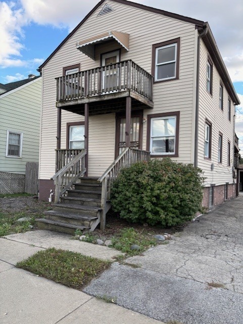 a view of a house with large windows