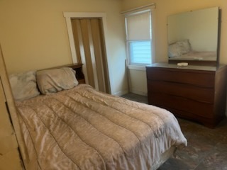 7113 West 71st Street Chicago, IL 60638 - Photo 5 of 16 a bedroom with a bed and a mirror on dresser