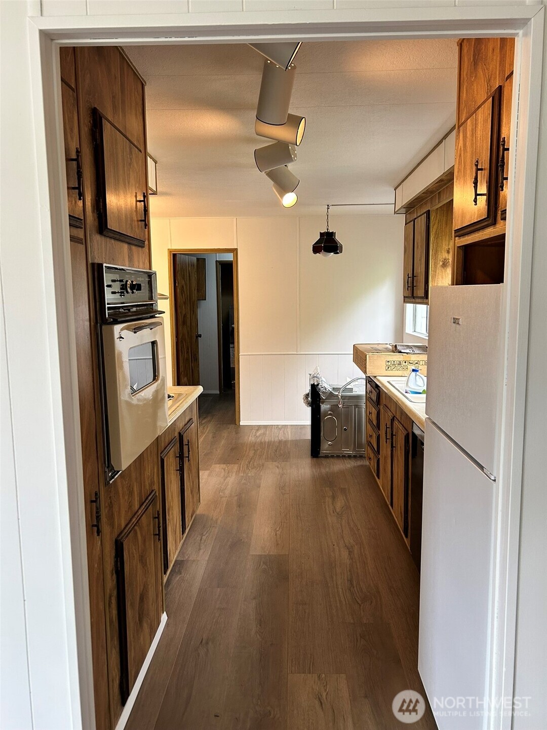 791 Elliot Court Sequim, WA 98382 - Photo 4 of 37 a kitchen with stainless steel appliances granite countertop a refrigerator and a stove