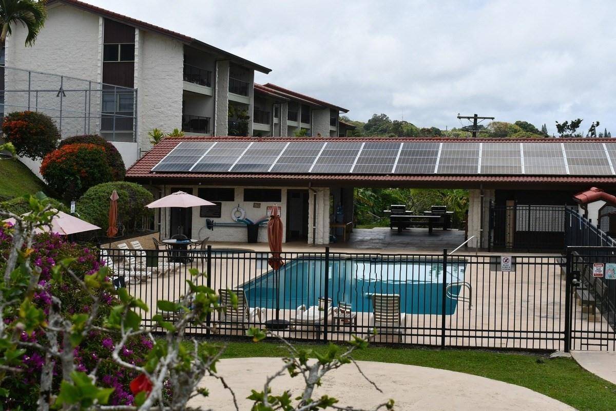 79-7199 Mamalahoa Highway, Unit 153 Holualoa, HI 96725 - Photo 1 of 1 a front view of a house with a garden