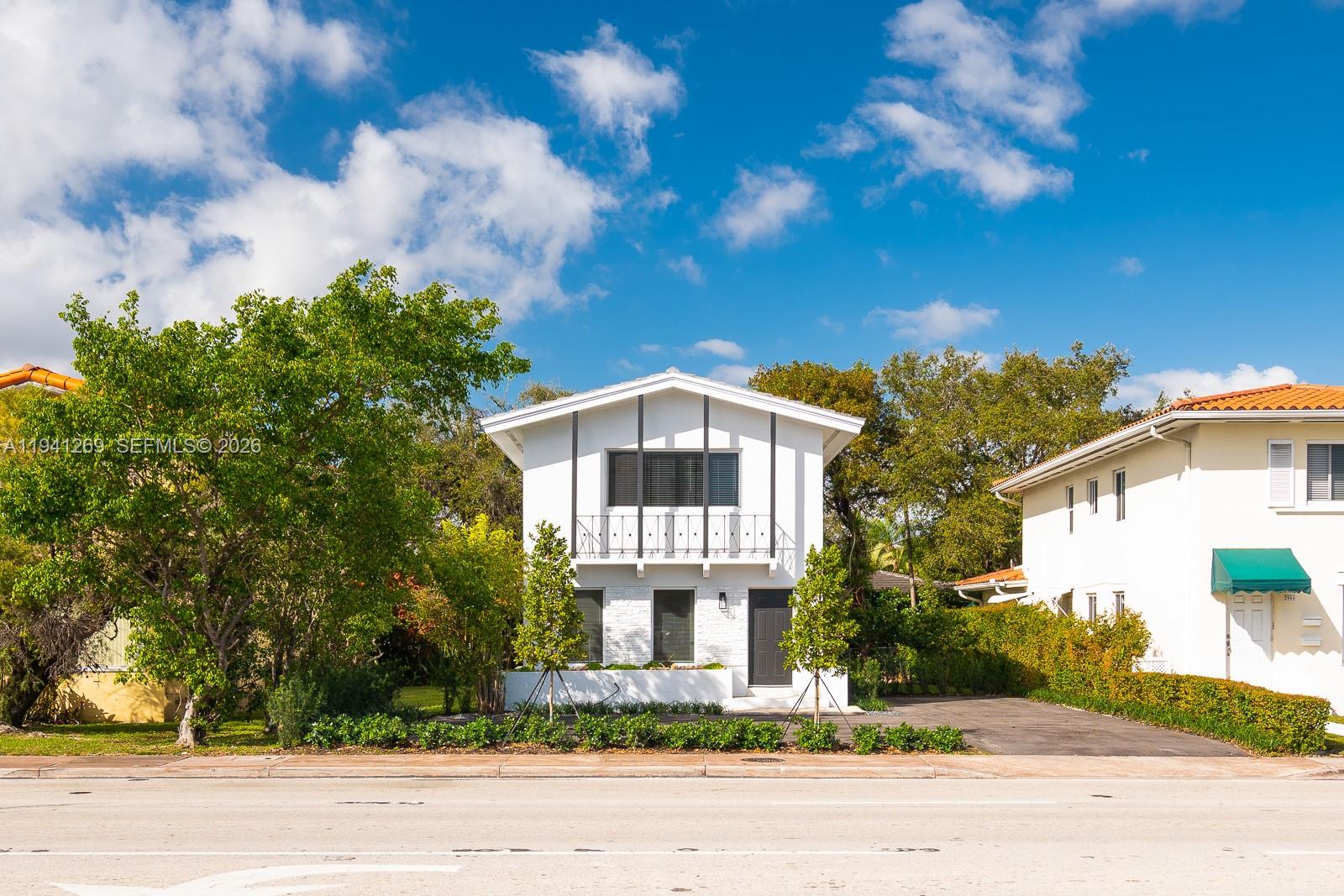 2922 South Le Jeune Road, Unit 2 Coral Gables, FL 33134 - Photo 13 of 17 a front view of a house with a yard