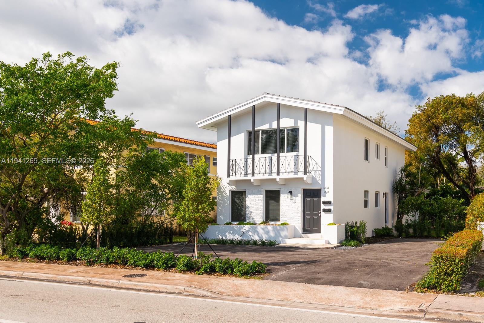 2922 South Le Jeune Road, Unit 2 Coral Gables, FL 33134 - Photo 13 of 16 a front view of a house with a yard