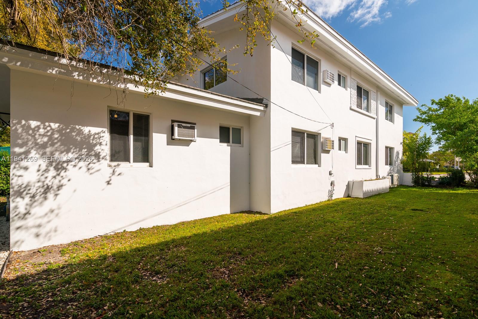 2922 South Le Jeune Road, Unit 2 Coral Gables, FL 33134 - Photo 15 of 17 a view of a white house with a yard