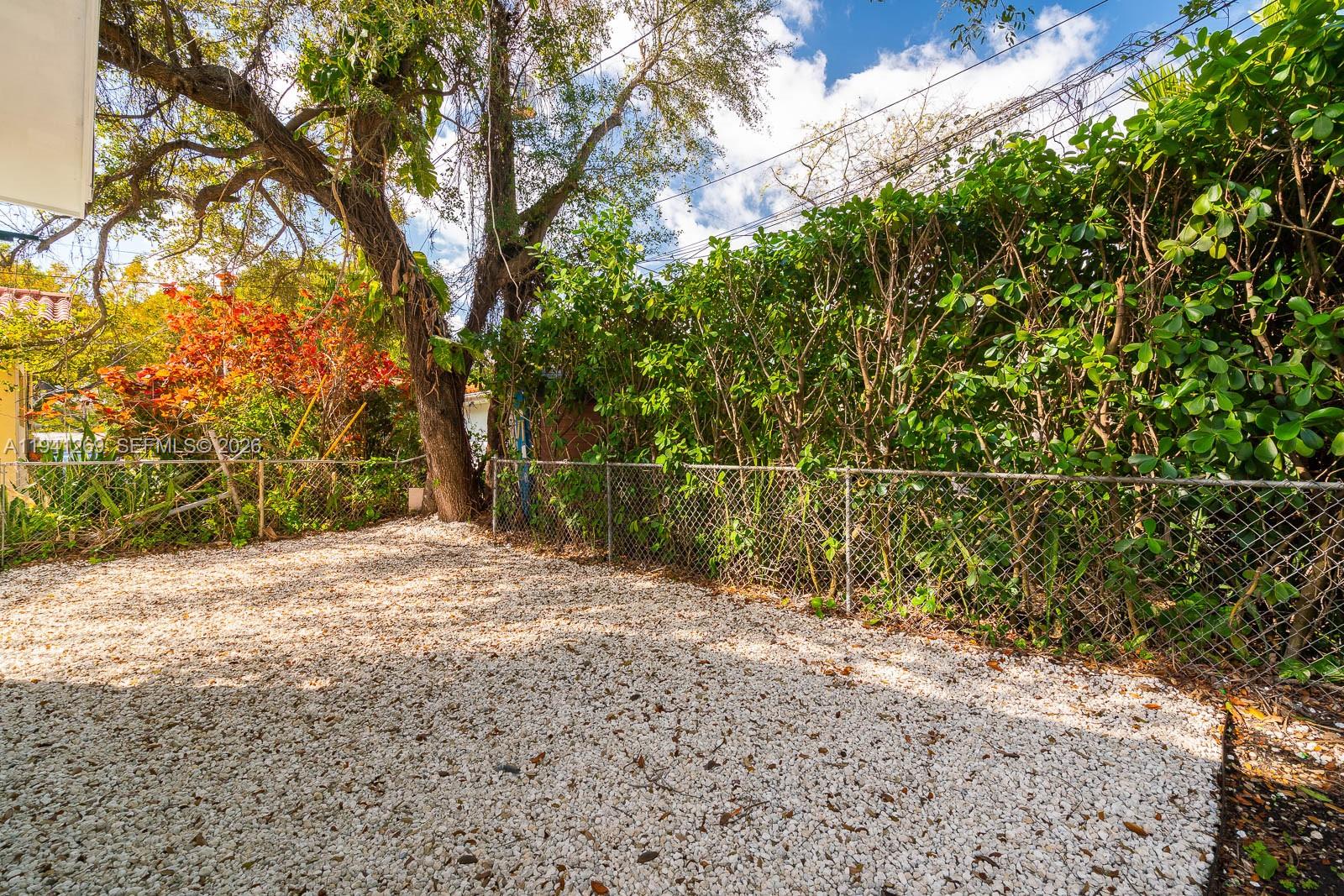 2922 South Le Jeune Road, Unit 2 Coral Gables, FL 33134 - Photo 16 of 17 a backyard of a house with lots of green space
