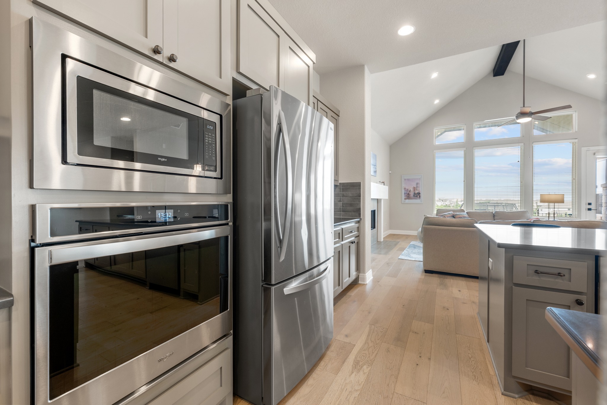 510 Elworth Path Austin, TX 78738 - Photo 5 of 40 a kitchen with stainless steel appliances a stove microwave and a refrigerator