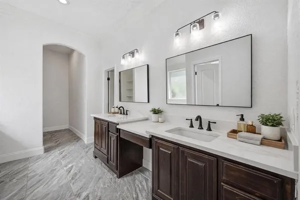a bathroom with a tub toilet and a sink