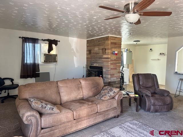 726 East 3rd Street Cortez, CO 81321 - Photo 6 of 20 a living room with furniture ceiling fan and a rug