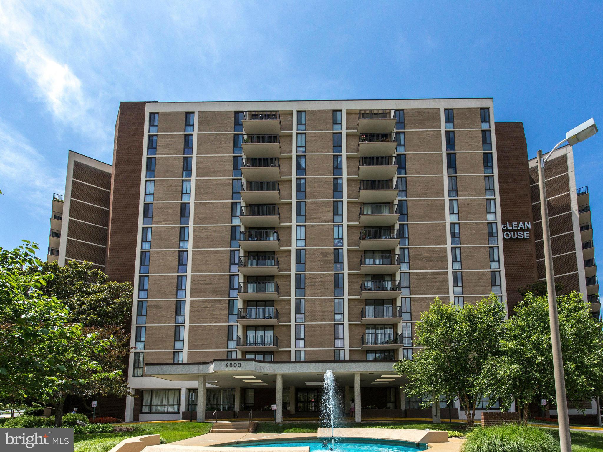 6800 Fleetwood Road, Unit 711 McLean, VA 22101 - Photo 1 of 27 a front view of a building with a garden