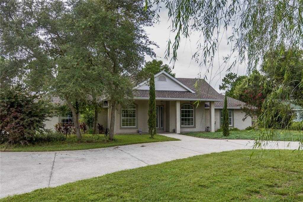 40835 Royal Trails Road Eustis, FL 32736 - Photo 1 of 1 Front of Home w/Circular Drive