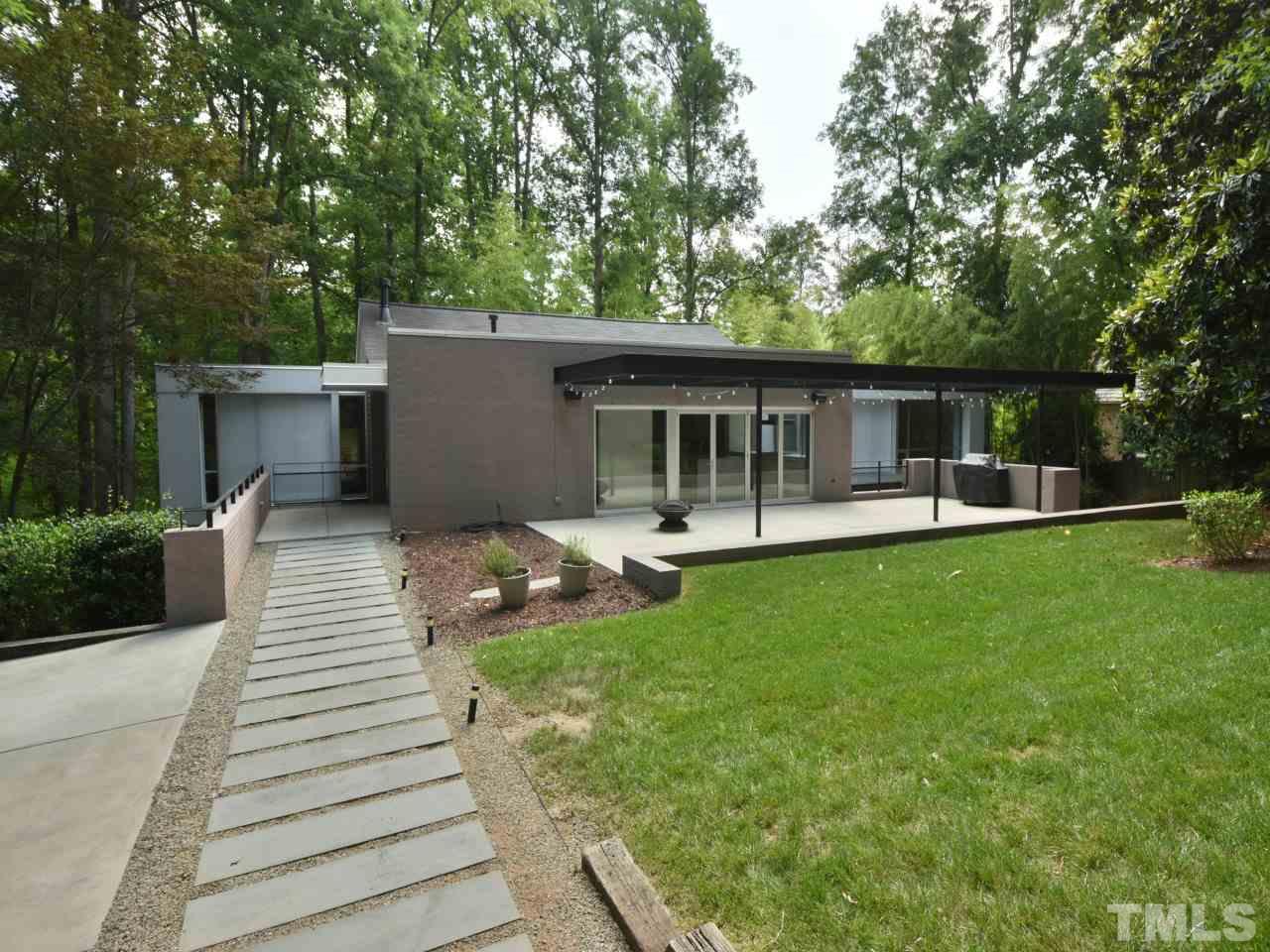 2109 St James Road Raleigh, NC 27607 - Photo 1 of 25 a view of a house with backyard and sitting area