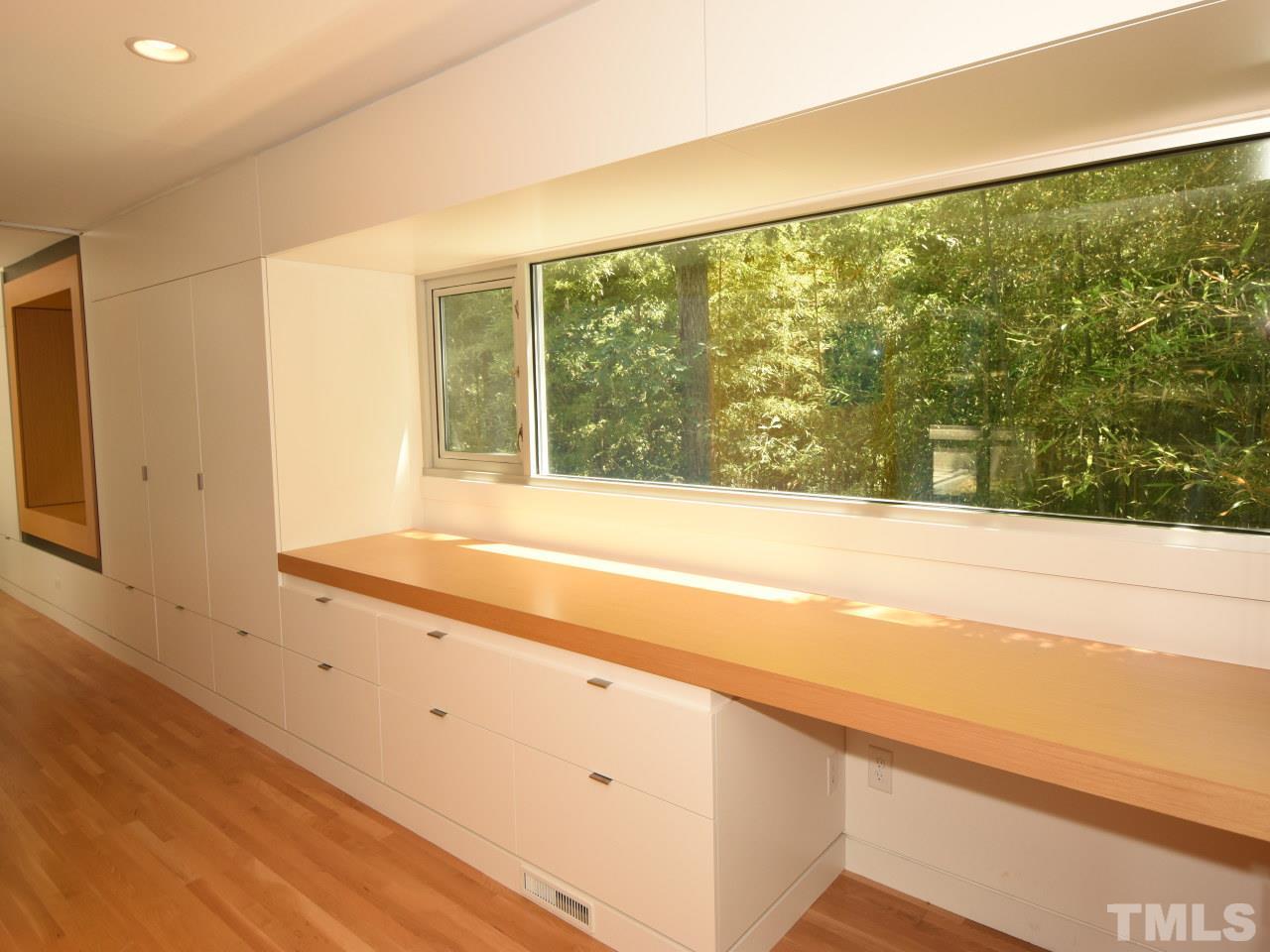 2109 St James Road Raleigh, NC 27607 - Photo 14 of 25 a view of walk in closet with clothes and shoes