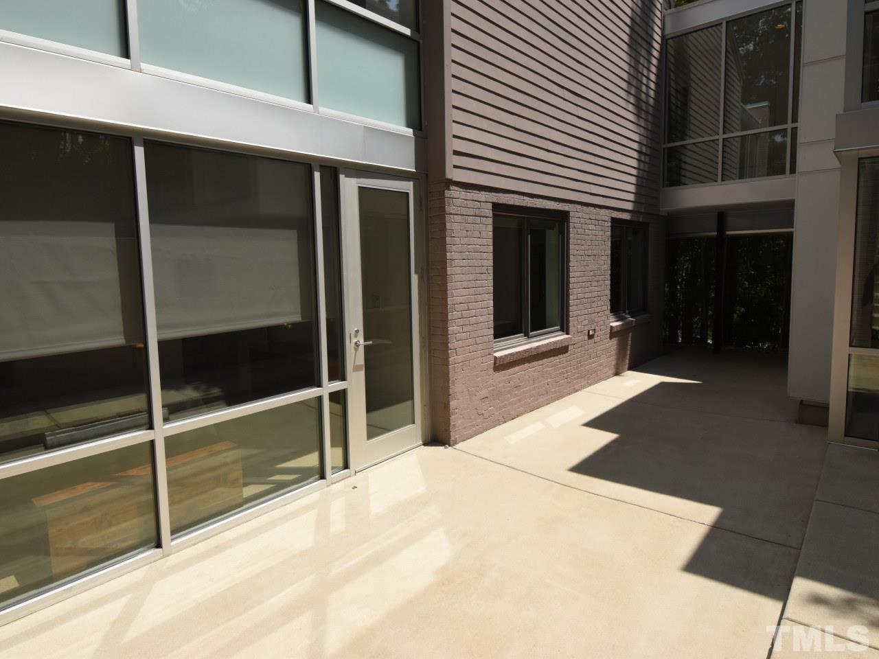 2109 St James Road Raleigh, NC 27607 - Photo 19 of 25 a view of a house with a balcony and door