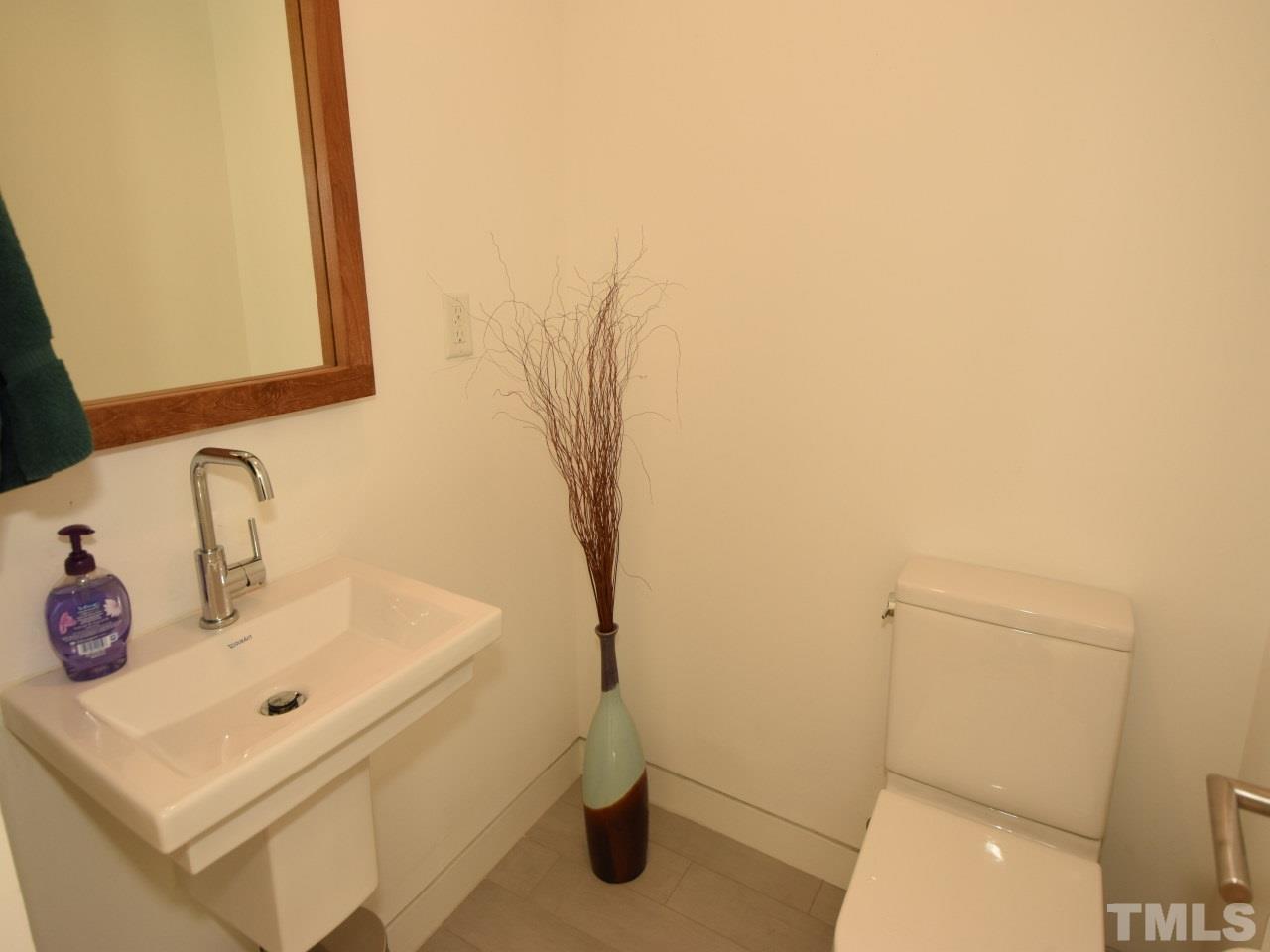 2109 St James Road Raleigh, NC 27607 - Photo 20 of 25 a bathroom with a sink and a toilet