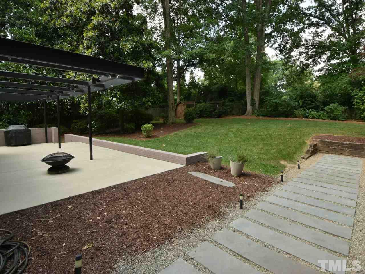 2109 St James Road Raleigh, NC 27607 - Photo 3 of 25 a view of a backyard with a sitting area