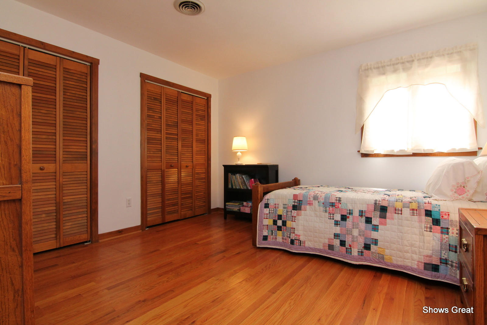 5462 Lakedale Road Southwest Roanoke, VA 24018 - Photo 25 of 45 a bedroom with a bed and wooden floor