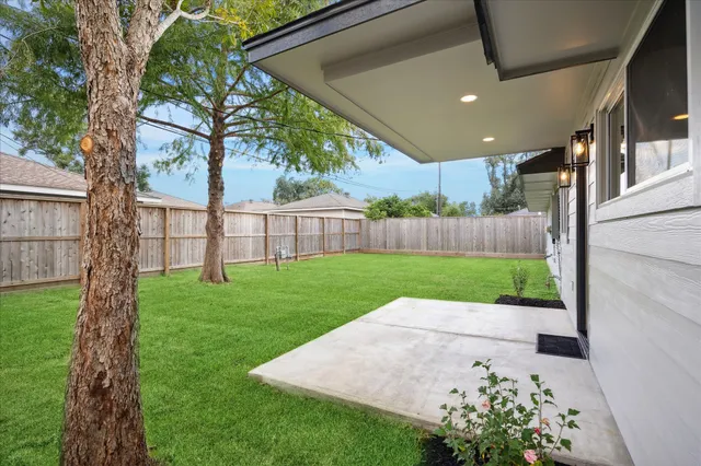 a view of a back yard with a small garden