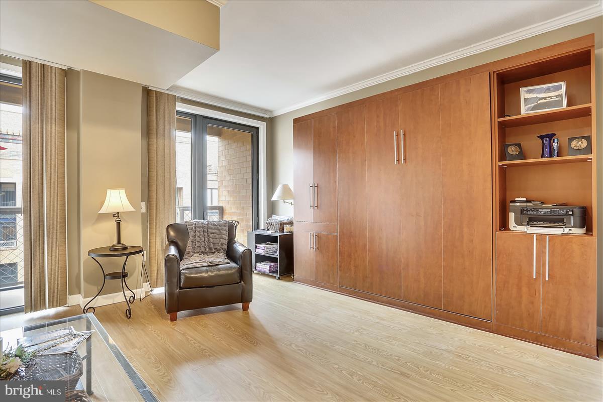 616 E Street Northwest, Unit 1207 Washington, DC 20004 - Photo 12 of 25 a living room with furniture and a window