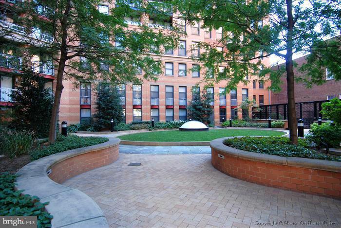 616 E Street Northwest, Unit 1207 Washington, DC 20004 - Photo 17 of 25 front view of a house with a yard